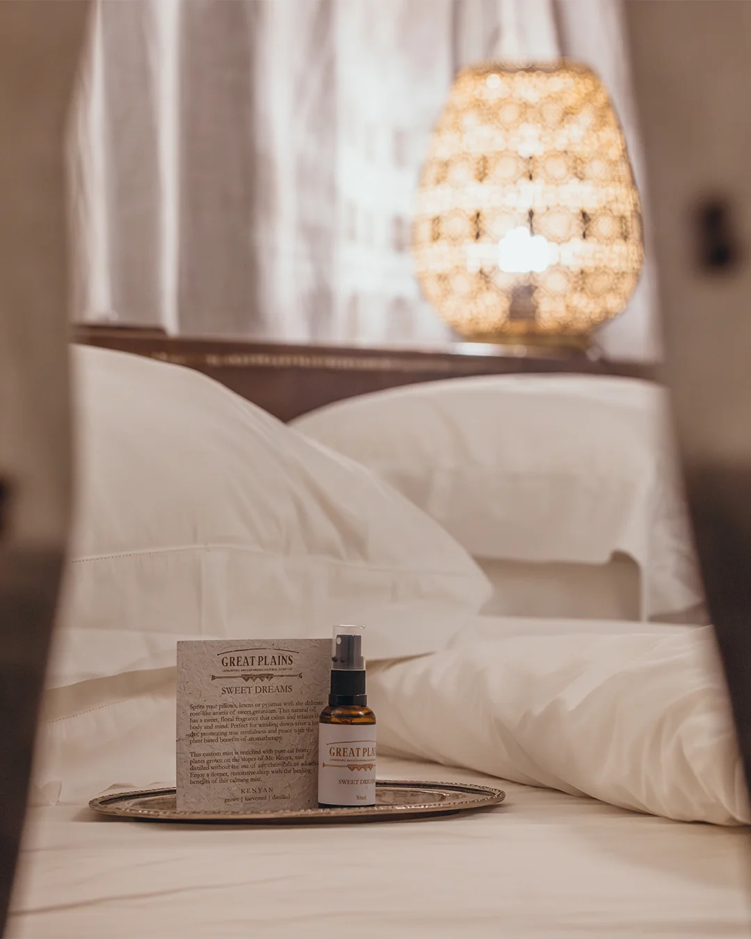 Fresh bed linen, a bedside lamp and a Great Plains Sweet Dreams amenity