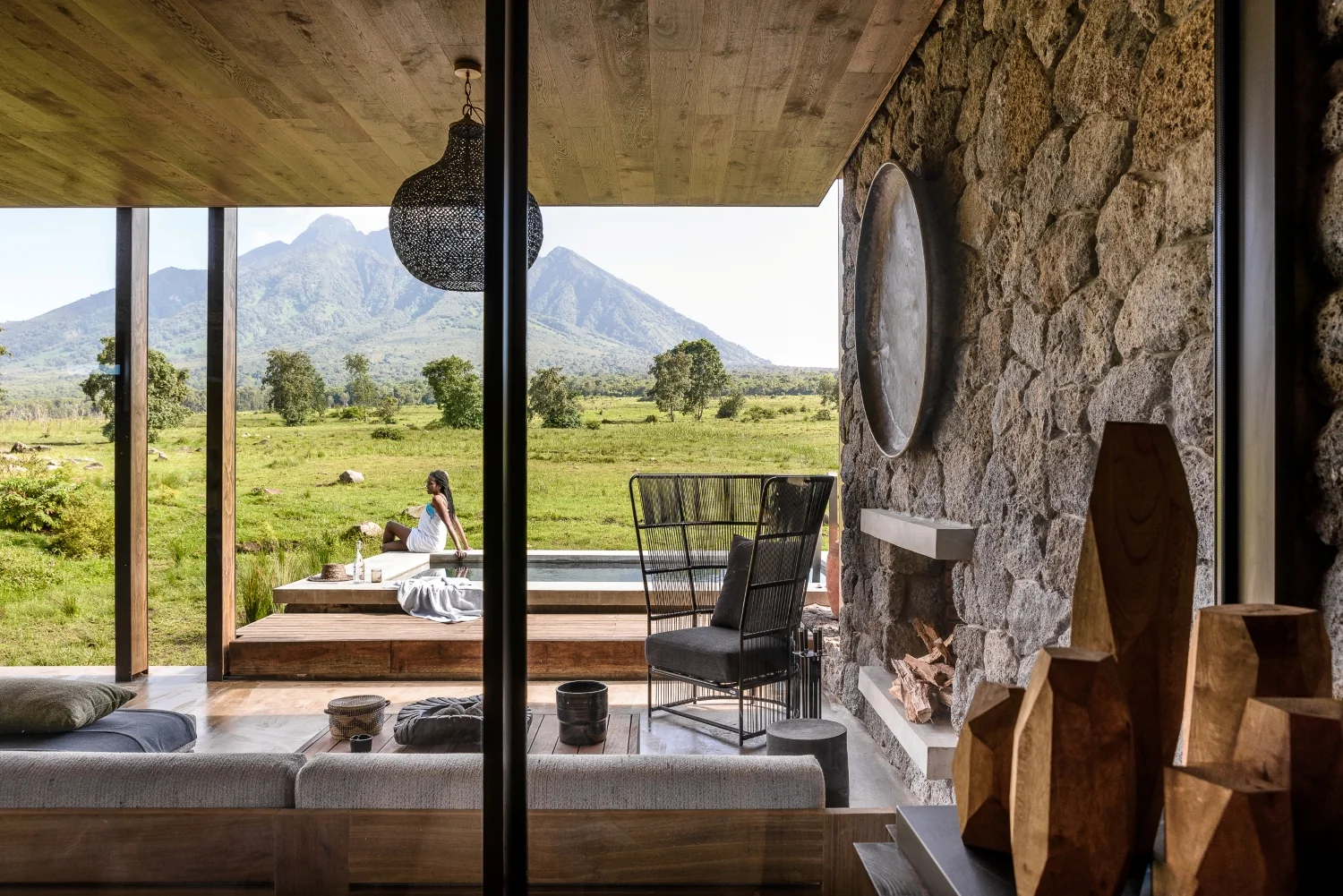 Lounge overlooking the pool at Singita Kwitonda Lodge